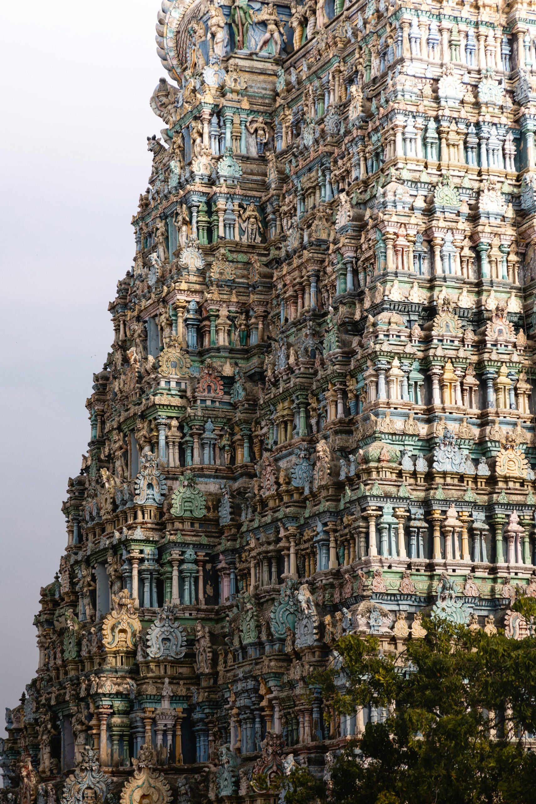 Detailed view of the ornate Meenakshi Amman Temple towers in Madurai, India showcasing stunning architecture.