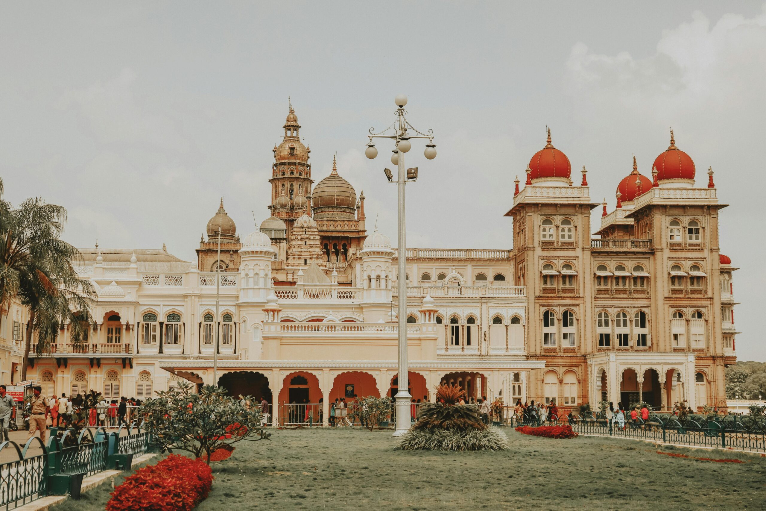 Mysore Palace's iconic architecture attracts tourists in Karnataka, India.